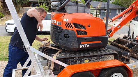 mini excavator in enclosed trailer|mini excavator tie down requirements.